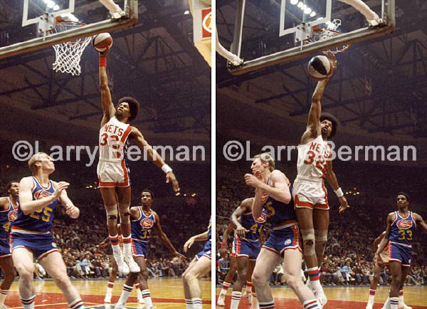 The Nets Julius Erving dunking over Dan Issel of the Denver Nuggets